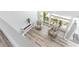 Upstairs bonus room with fireplace and striped chairs overlooking balcony at 1390 Gulf Blvd # Ph-5, Clearwater, FL 33767