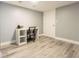 Small bonus space with a desk and light-colored, wood-look floors at 1390 Gulf Blvd # Ph-5, Clearwater, FL 33767