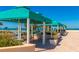 Beautiful covered outdoor lounge area with seating, landscaping, and ocean views at 1390 Gulf Blvd # Ph-5, Clearwater, FL 33767