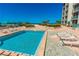 Enjoy the community's outdoor pool and sundeck with lounge chairs overlooking the beach and ocean at 1390 Gulf Blvd # Ph-5, Clearwater, FL 33767