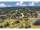 High aerial view pointing towards home near golf course, residential area, and water tower at 1450 Palmetto St, Clearwater, FL 33755
