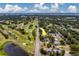 High aerial view pointing towards home near a golf course and a busy street with residential area nearby at 1450 Palmetto St, Clearwater, FL 33755