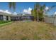 This house has a backyard with a screened in pool at 1450 Palmetto St, Clearwater, FL 33755