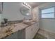 Bright bathroom features a double sink vanity with vessel sinks and decorative backsplash at 1450 Palmetto St, Clearwater, FL 33755