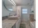 Bright bathroom with double sink vanity and lots of natural light at 1450 Palmetto St, Clearwater, FL 33755
