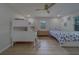 Bedroom features a twin-over-full bunk bed and a twin bed at 1450 Palmetto St, Clearwater, FL 33755