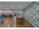 Dining area with seating for eight, open to the updated kitchen and views of the backyard at 1450 Palmetto St, Clearwater, FL 33755