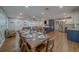 Open-concept dining area leading to the fireplace living area and to the updated kitchen at 1450 Palmetto St, Clearwater, FL 33755