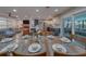 Dining room with seating, that looks onto the spacious living room and a bright updated kitchen at 1450 Palmetto St, Clearwater, FL 33755