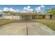 A carport that enhances the curb appeal of this residence at 1450 Palmetto St, Clearwater, FL 33755