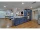 Kitchen with granite countertops and stainless appliances, that flows into the open-concept living spaces at 1450 Palmetto St, Clearwater, FL 33755