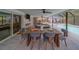 Screened lanai with an outdoor dining area next to the pool at 1450 Palmetto St, Clearwater, FL 33755