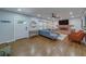 Bright living room featuring a modern fireplace and comfortable seating at 1450 Palmetto St, Clearwater, FL 33755