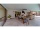 Comfortable covered patio featuring dining and seating areas, enhancing outdoor living at 1450 Palmetto St, Clearwater, FL 33755