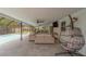 Screened-in patio with an egg chair, comfortable seating, and a view of the pool at 1450 Palmetto St, Clearwater, FL 33755