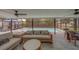 Covered patio has comfortable seating and dining with a clear view of the pool at 1450 Palmetto St, Clearwater, FL 33755