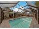 Stunning screened-in pool area with comfortable lounge seating, perfect for relaxation and entertainment at 1450 Palmetto St, Clearwater, FL 33755