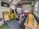 A fully equipped game room features a foosball table and a vintage Pac-Personal arcade machine at 1450 Palmetto St, Clearwater, FL 33755