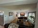Inviting living room with hardwood floors, a stylish rug, and an entertainment center for comfortable living at 1504 Orange St, Clearwater, FL 33756