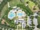 Aerial view of community pool and recreation area showcases spacious pool, lounge chairs, and lush green landscape at 15422 Starling Crossing Dr, Lithia, FL 33547