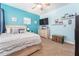 Bedroom featuring light blue walls, carpeted floors, and plenty of shelving at 15422 Starling Crossing Dr, Lithia, FL 33547