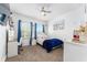Bedroom featuring two large windows, a white desk, and white decor at 15422 Starling Crossing Dr, Lithia, FL 33547