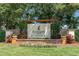 Elegant FishHawk Ranch sign with stone base and manicured flowerbeds at 15422 Starling Crossing Dr, Lithia, FL 33547