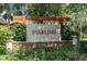 Attractive Starling community sign featuring stone accents and lush landscaping at 15422 Starling Crossing Dr, Lithia, FL 33547
