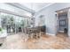 Cozy dining area with views of the outdoor patio and pool at 15422 Starling Crossing Dr, Lithia, FL 33547