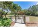 Fully fenced dog park with shade, seating, and pet waste station for a convenient and enjoyable experience for dog owners at 15422 Starling Crossing Dr, Lithia, FL 33547