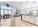 Open-concept kitchen showcasing granite countertops and a seamless transition to the dining and living areas at 15422 Starling Crossing Dr, Lithia, FL 33547