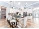 Updated kitchen with a stone accent island, bar stool seating, and stylish backsplash at 15422 Starling Crossing Dr, Lithia, FL 33547