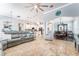 Spacious open-concept living area with tile flooring and seamless flow to the dining and kitchen areas at 15422 Starling Crossing Dr, Lithia, FL 33547