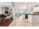 Open-concept living area with stone accent wall, fireplace, and updated kitchen at 15422 Starling Crossing Dr, Lithia, FL 33547