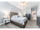 Comfortable bedroom with light blue decor, wooden floors and modern furnishings at 15422 Starling Crossing Dr, Lithia, FL 33547