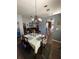 Dining area featuring chandelier lighting and wood floors at 16035 Grass Lake Dr, Tampa, FL 33618
