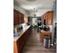 Galley kitchen featuring wood cabinets and granite countertops at 16035 Grass Lake Dr, Tampa, FL 33618