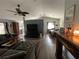 Bright living room flowing into the dining area, featuring hardwood floors at 16035 Grass Lake Dr, Tampa, FL 33618