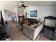 Open living room featuring modern decor, hardwood floors, and ample natural light at 16035 Grass Lake Dr, Tampa, FL 33618