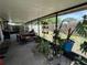 Outdoor patio area for al fresco dining and relaxation with assorted potted plants and garden views at 16035 Grass Lake Dr, Tampa, FL 33618