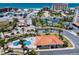 Scenic aerial view of community clubhouse, pool, tennis courts, and beach access at 17735 Gulf Blvd # 304, Redington Shores, FL 33708