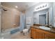 Well-lit bathroom featuring neutral tile, granite counters, and modern fixtures at 17735 Gulf Blvd # 304, Redington Shores, FL 33708