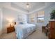 Comfortable bedroom with ceiling fan and light-filled windows at 17735 Gulf Blvd # 304, Redington Shores, FL 33708
