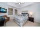Comfortable bedroom with ceiling fan, TV, and serene decor for a relaxing retreat at 17735 Gulf Blvd # 304, Redington Shores, FL 33708
