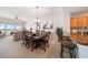 Open-concept dining area connecting to living room and kitchen with seating for six at 17735 Gulf Blvd # 304, Redington Shores, FL 33708