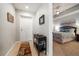 Inviting hallway with neutral tile flooring and decor, leading to a light-filled bedroom at 17735 Gulf Blvd # 304, Redington Shores, FL 33708