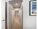 Hallway showing several doorways leading to rooms and closets, light neutral color scheme at 17735 Gulf Blvd # 304, Redington Shores, FL 33708