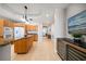 Open kitchen layout with a center island, stainless steel appliances, and modern lighting at 17735 Gulf Blvd # 304, Redington Shores, FL 33708