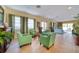 Community lounge featuring tile flooring, comfortable seating, and large windows with curtains at 17735 Gulf Blvd # 304, Redington Shores, FL 33708
