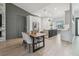 Spacious dining area adjacent to the kitchen featuring a modern table and stylish decor at 18902 Spring Hollow Dr, Lutz, FL 33559
